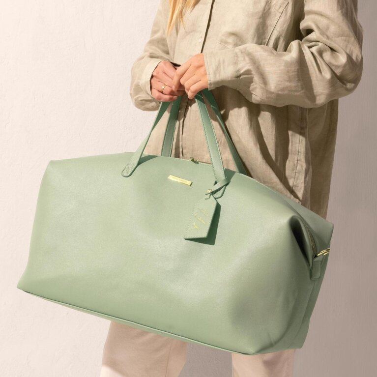 Sage green Katie Loxton Weekend Bag with a sweet sentiment on Luggage tag and an adjustable, removable shoulder strap 